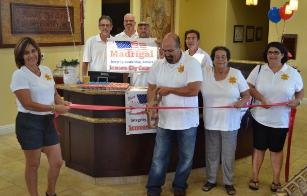 Ray Madrigal, a candidate for city council and a new Chamber of Commerce member, cut the ribbon at his Friday night Meet and Greet.